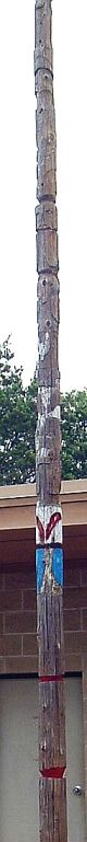 Totem pole in front
                of training center